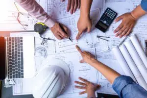 civil engineers work on blueprint