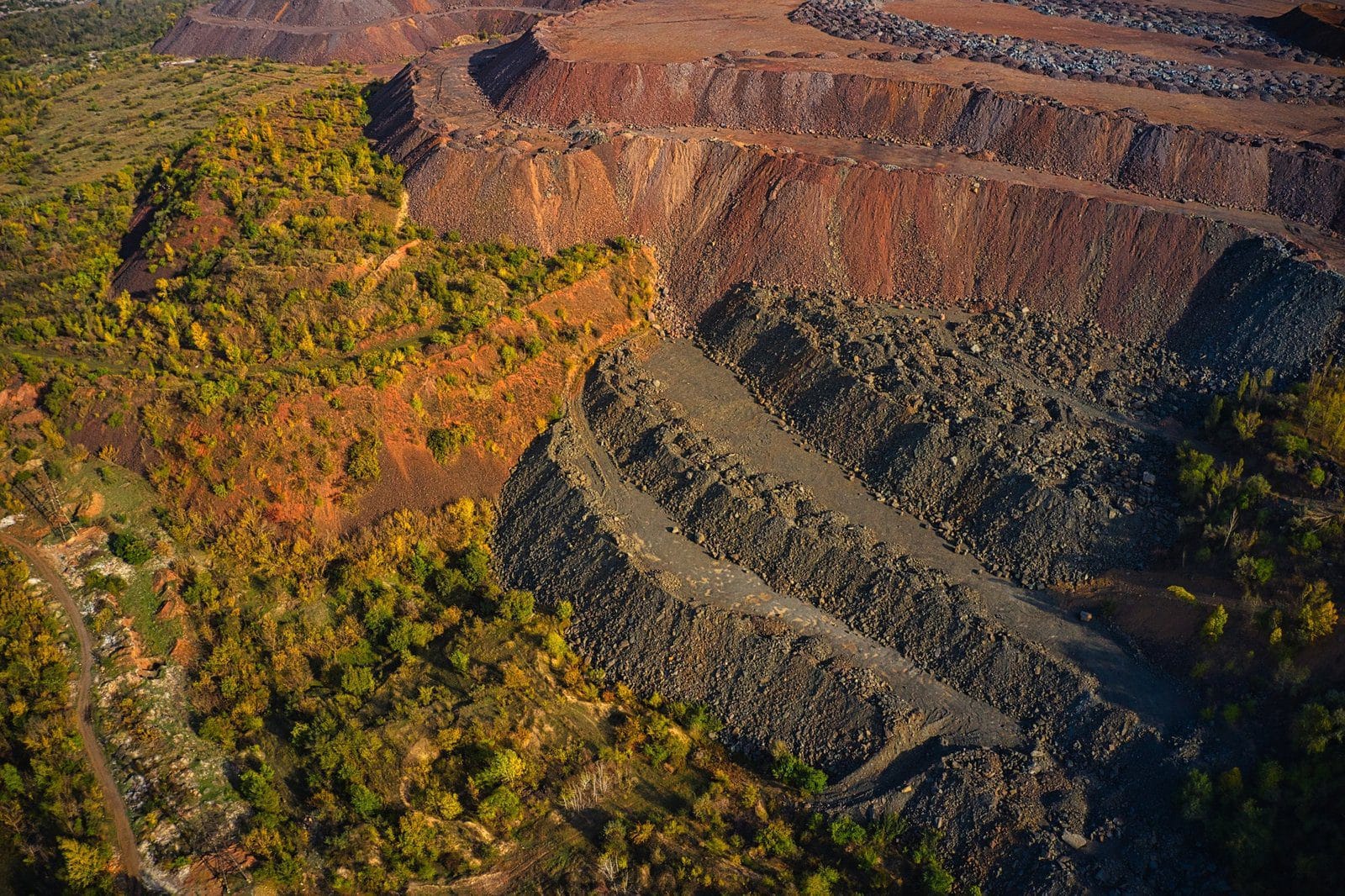 Huge mounds of waste iron ore near the quarry