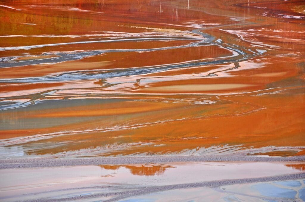 Pollution of a lake with contaminated water. Rosia Montana, Romania