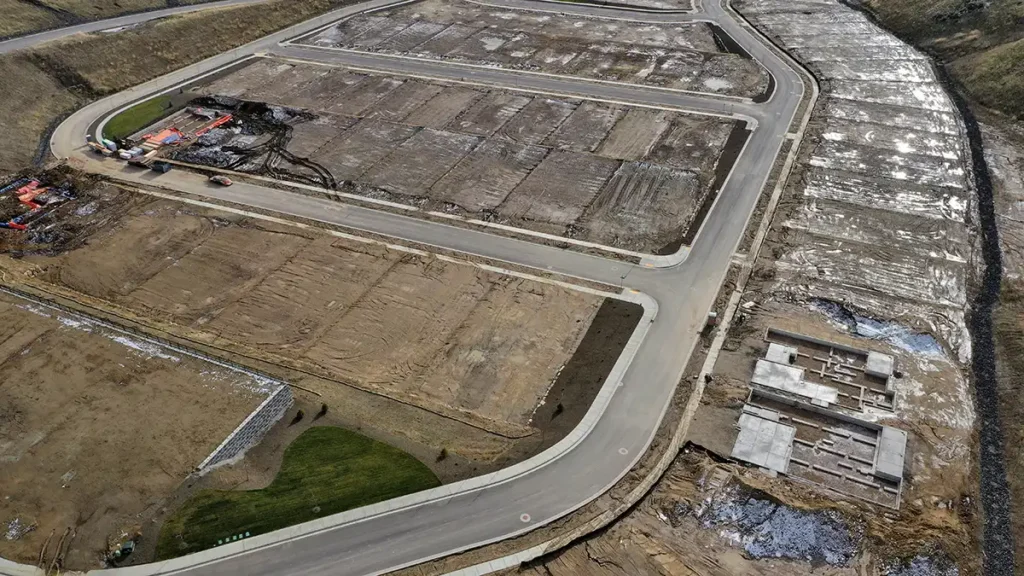 What Engineering Services Are Needed for a Residential Land Development Project? 2 Overhead Aerial View of Brand New Residential Subdivision with Platted Lots and Road Infrastructure Under Early Construction