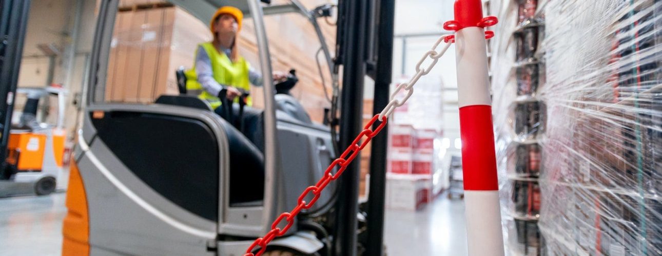 Safety at work with forklift in warehouse